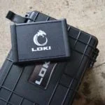 Loki Diagnostic device ontop of it's carrying case, outside